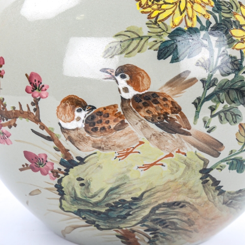 72 - A Chinese green glaze vase with painted birds and flowers, height 46cm, signed under base