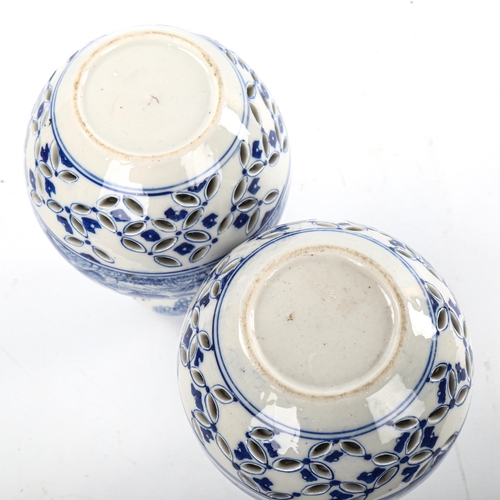 77 - A pair of Japanese blue and white porcelain double-gourd vases, with hand painted decoration and ret... 