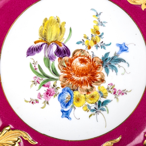 79 - A Meissen porcelain table centre bowl, hand painted botanical centre panel in red and gilt border, d... 