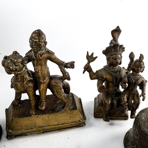 81 - A group of Antique Indian bronze deities, largest height 32cm (9)