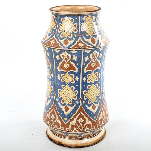 82 - A French pottery albarello, with hand painted and glazed Iznik style decoration, height 26cm