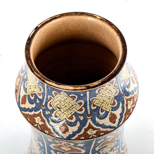 82 - A French pottery albarello, with hand painted and glazed Iznik style decoration, height 26cm