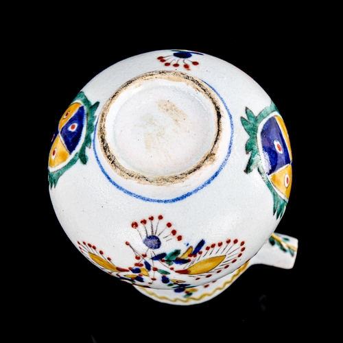 85 - A Turkish Kutahya pottery coffee pot, with painted decoration, height 12cm