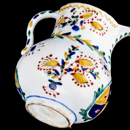 85 - A Turkish Kutahya pottery coffee pot, with painted decoration, height 12cm