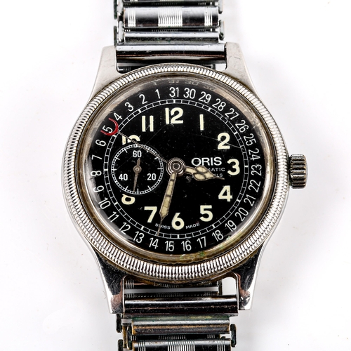 407 - ORIS - a Vintage stainless steel Pointer Date automatic bracelet watch, ref. 2462, black dial with l... 