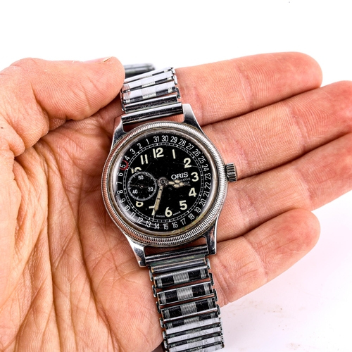 407 - ORIS - a Vintage stainless steel Pointer Date automatic bracelet watch, ref. 2462, black dial with l... 