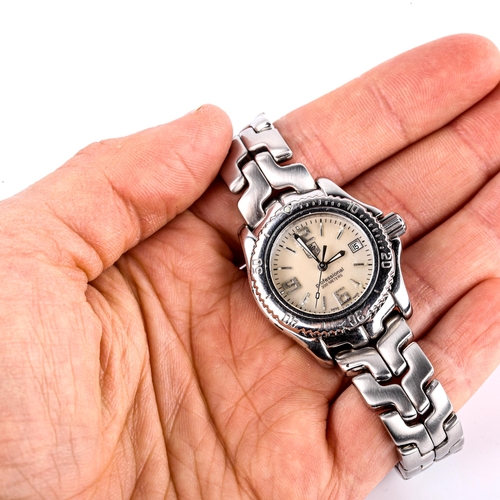 426 - TAG HEUER - a lady's stainless steel Professional 200M quartz bracelet watch, ref. WT141A, mother-of... 