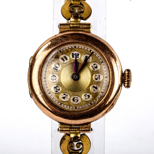 429 - A lady's Vintage 9ct gold cased mechanical wristwatch, gilt dial with Arabic numerals and blued stee... 