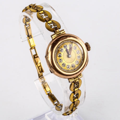 429 - A lady's Vintage 9ct gold cased mechanical wristwatch, gilt dial with Arabic numerals and blued stee... 