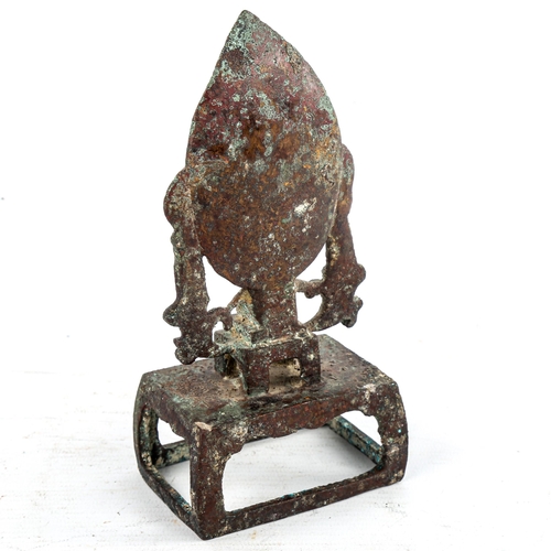 175 - A Chinese verdigris bronze shrine, surmounted by Buddha figures, height 17cm