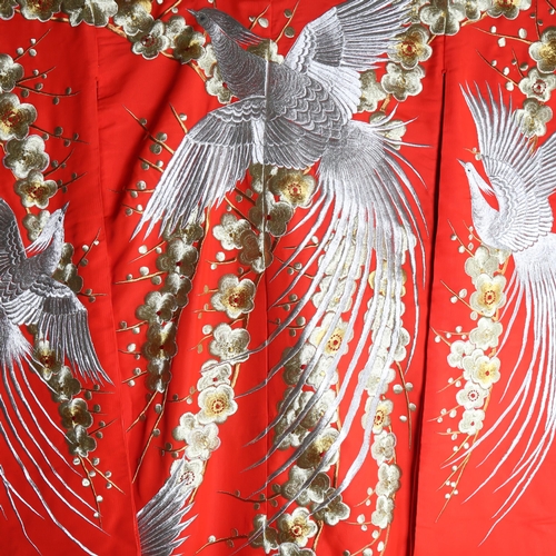 63 - A Japanese wedding kimono, red silk ground with gold and silver embroidered wirework decoration, tog... 