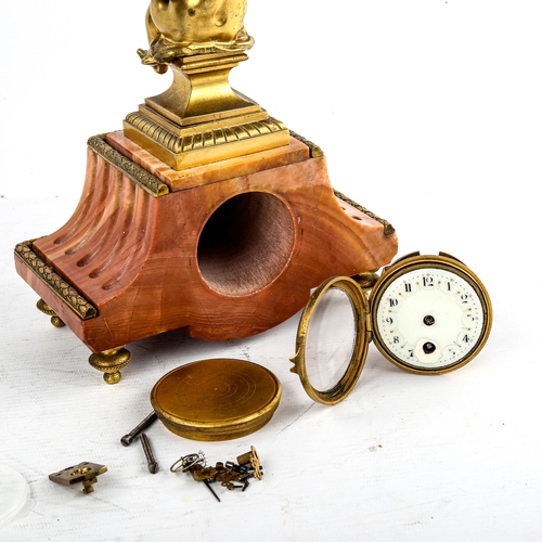 460 - An early 20th century French red marble-cased mantel clock, surmounted by gilt-bronze cherub, overal... 