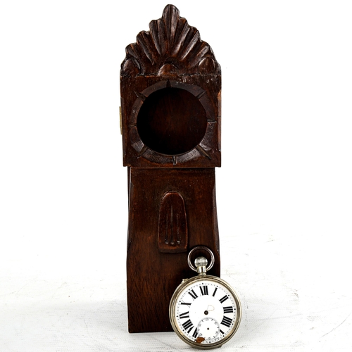 461 - A stained oak pocket watch stand, modelled as a longcase clock, overall height 23cm, pocket watch op... 