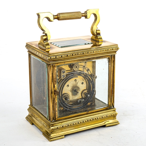 453 - A large French brass-cased carriage clock, by L Vincent of Avignon, oval silvered dial with Roman nu... 