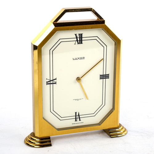 456 - LUXOR - a Vintage brass-cased mantel clock, retailed by Garrard & Co Ltd, white enamel dial with qua... 