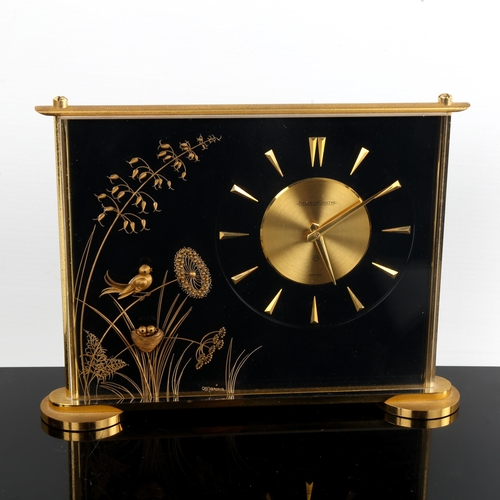 457 - JAEGER LECOULTRE - a brass-cased Marina 8-day mantel clock, gilt dial with arrowhead hour markers, b... 