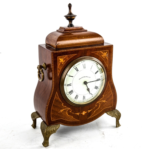 458 - An Edwardian inlaid shaped mahogany mantel clock, by Walker & Hall Ltd, white enamel dial with Roman... 