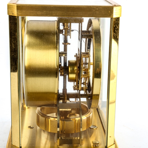 459 - JAEGER LECOULTRE - a Vintage brass-cased Atmos clock, white chapter ring with gilt quarterly Arabic ... 