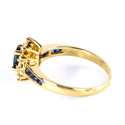 507 - A modern 18ct gold sapphire and diamond cluster ring, set with oval mixed-cut sapphire, round brilli... 