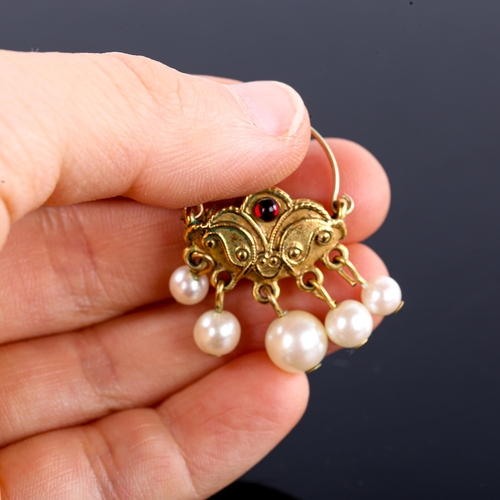 510 - A pair of unmarked yellow metal Turkish crescent hoop earrings, set with cabochon garnets and en tre... 