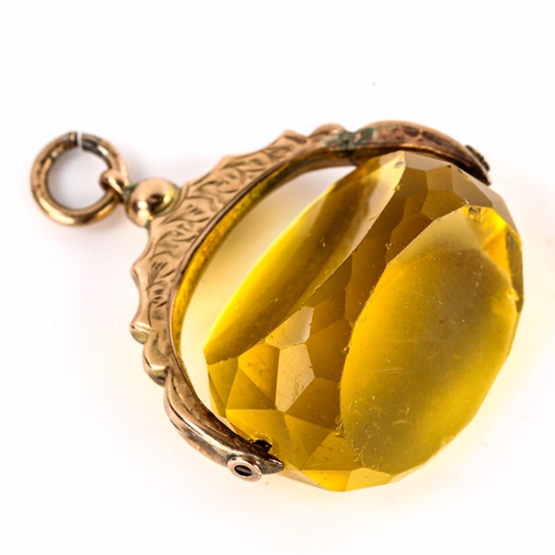 519 - An early 20th century 9ct gold faceted citrine swivel fob, foliate engraved mount, hallmarks Chester... 