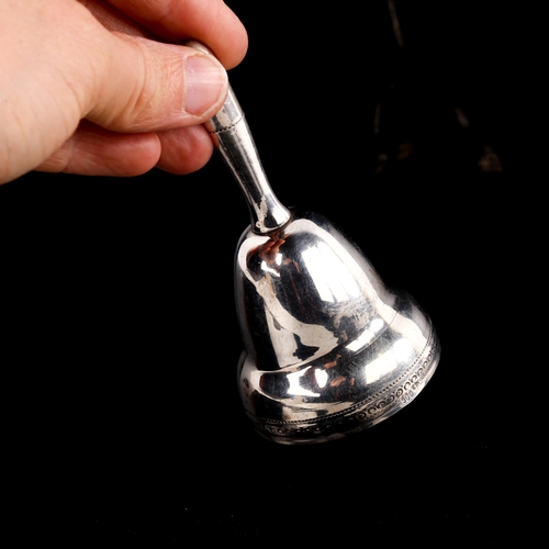 552 - An early 20th century Continental silver table bell, bright-cut engraved decoration, height 9cm