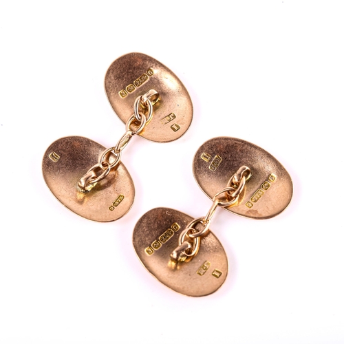 557 - A pair of early 20th century 9ct rose gold oval bombe panel cufflinks, hallmarks Birmingham 1906, pa... 