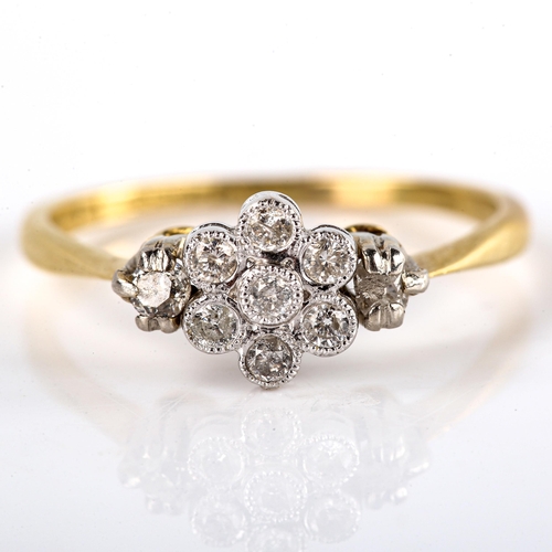 561 - A mid-20th century 18ct gold diamond cluster flowerhead ring, set with round brilliant and old-cut d... 