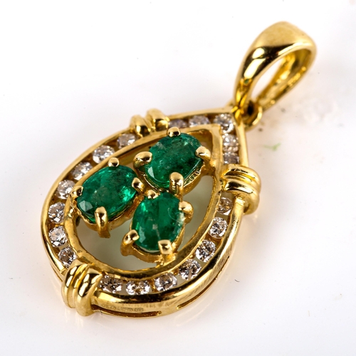 565 - A modern 18ct gold emerald and diamond pear cluster pendant, set with oval mixed-cut emeralds and ro... 