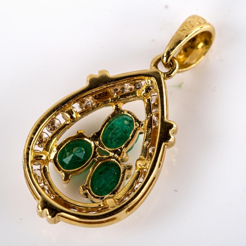 565 - A modern 18ct gold emerald and diamond pear cluster pendant, set with oval mixed-cut emeralds and ro... 