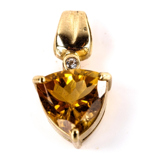 567 - A modern 9ct gold citrine and cubic zirconia pendant, set with trilliant-cut citrine and round-cut C... 