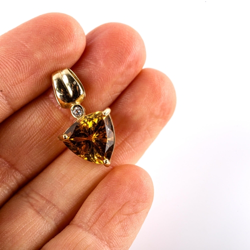 567 - A modern 9ct gold citrine and cubic zirconia pendant, set with trilliant-cut citrine and round-cut C... 