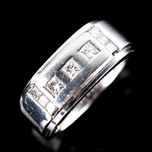 570 - A large 14ct white gold Princess-cut diamond ring, total diamond content approx 0.65ct, setting heig... 