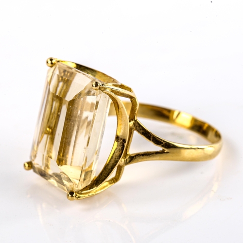 573 - A large Continental unmarked gold citrine dress ring, set with emerald-cut citrine, length 20mm, siz... 