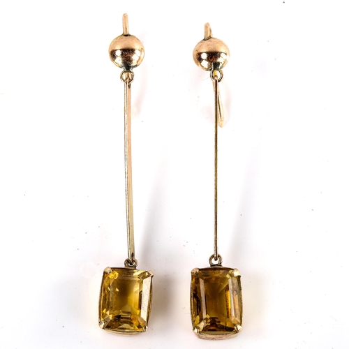 575 - A pair of citrine drop pendant earrings, unmarked yellow metal settings, with emerald step-cut citri... 