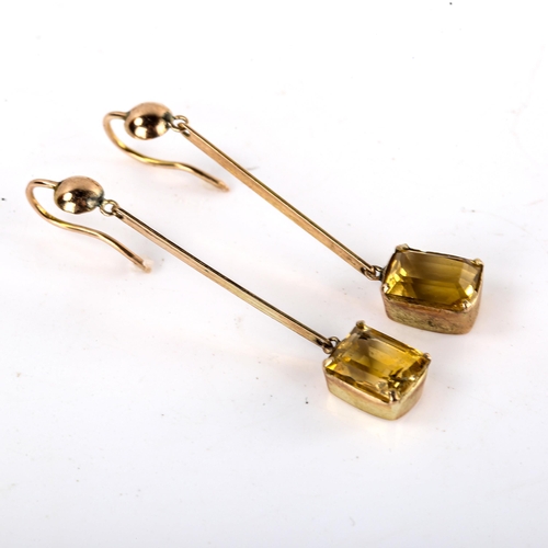 575 - A pair of citrine drop pendant earrings, unmarked yellow metal settings, with emerald step-cut citri... 