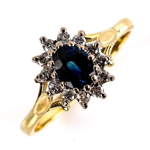 577 - A late 20th century 18ct gold sapphire and diamond cluster ring, set with oval mixed-cut sapphire an... 