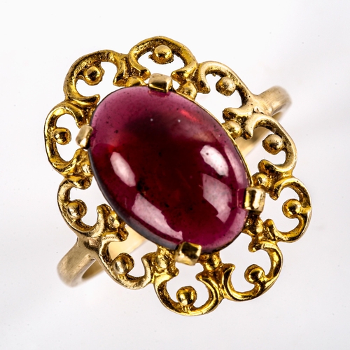 578 - A large late 20th century garnet dress ring, openwork settings with oval cabochon garnet, setting he... 