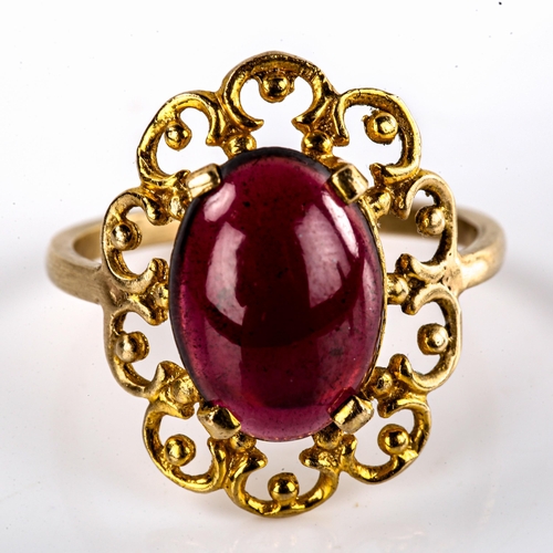 578 - A large late 20th century garnet dress ring, openwork settings with oval cabochon garnet, setting he... 