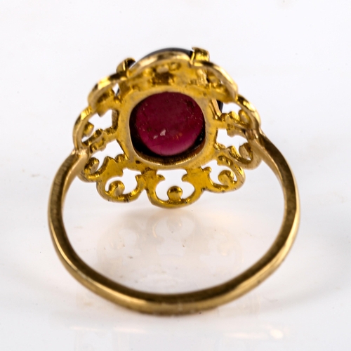 578 - A large late 20th century garnet dress ring, openwork settings with oval cabochon garnet, setting he... 