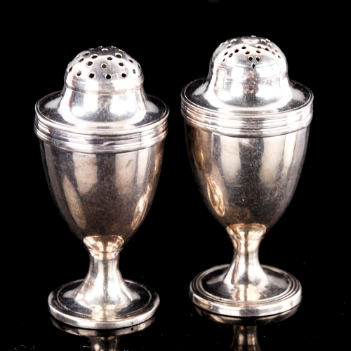 584 - A pair of George III silver baluster pepperettes, indistinct maker's marks, hallmarks London 1797/17... 