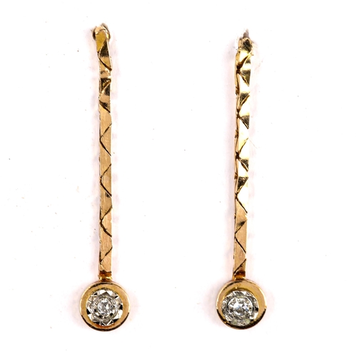 585 - A pair of unmarked gold solitaire diamond drop pendant earrings, set with single-cut diamonds, earri... 