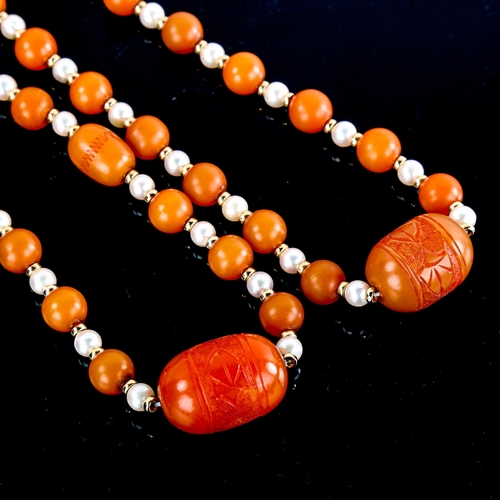 590 - A single-row amber bead and pearl sautoir necklace, with unmarked yellow metal spacers and carved am... 