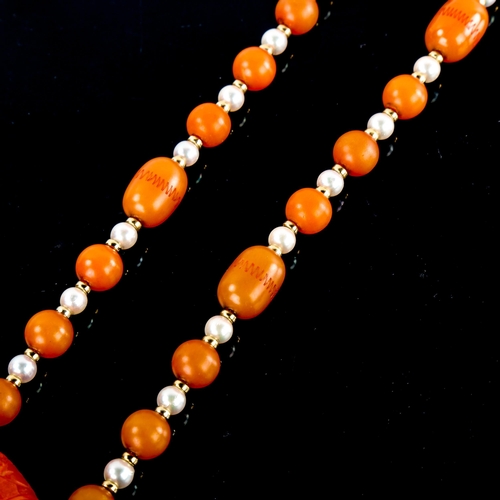 590 - A single-row amber bead and pearl sautoir necklace, with unmarked yellow metal spacers and carved am... 