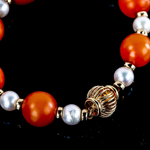 591 - An amber and pearl bead bracelet, with 14ct gold clasp and spacers, largest bead length 19.1mm, brac... 