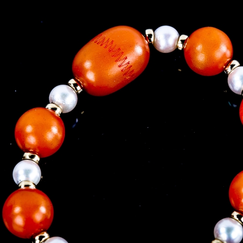 591 - An amber and pearl bead bracelet, with 14ct gold clasp and spacers, largest bead length 19.1mm, brac... 