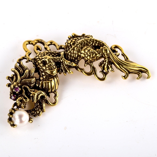 598 - A Franklin Mint sterling silver-gilt Year of the Dragon pendant/brooch, openwork settings with ruby ... 