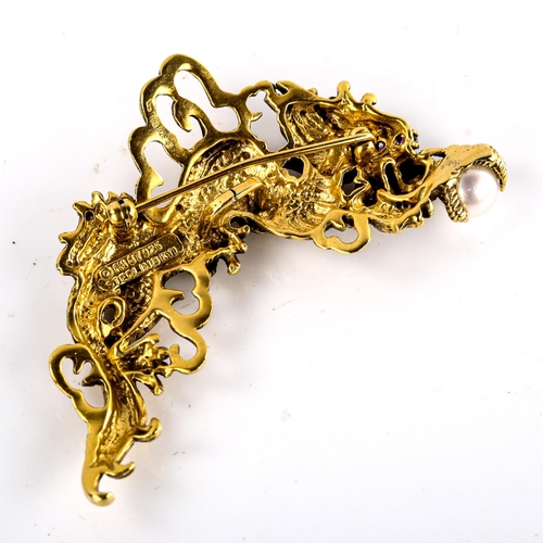 598 - A Franklin Mint sterling silver-gilt Year of the Dragon pendant/brooch, openwork settings with ruby ... 