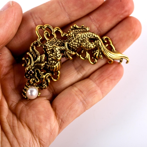 598 - A Franklin Mint sterling silver-gilt Year of the Dragon pendant/brooch, openwork settings with ruby ... 