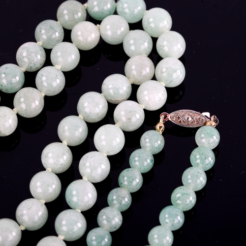 599 - 2 polished jade bead necklaces, largest length 74cm, 174.7g total (2)